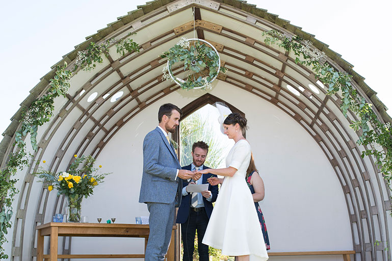 Bride and groom saying their vows at Eco Park wedding