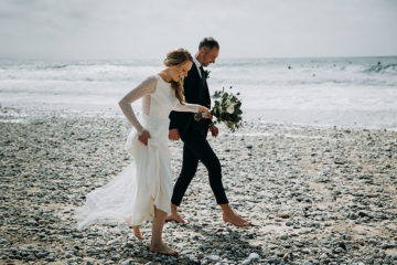 Bride and Groom on Porthtowan beach on wedding day in Cornwall