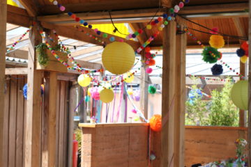 Colourful pom pom garlands and lantern wedding decoration at Eco Park wedding venue