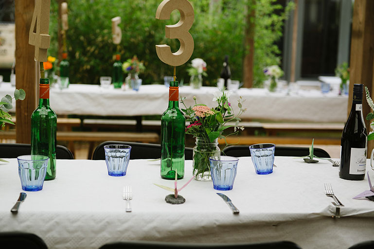 Wedding tablescape with blue glasses and flowers