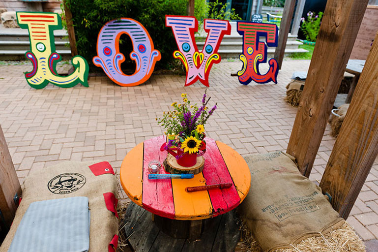 Circus colourful wooden love letters at Eco Park wedding